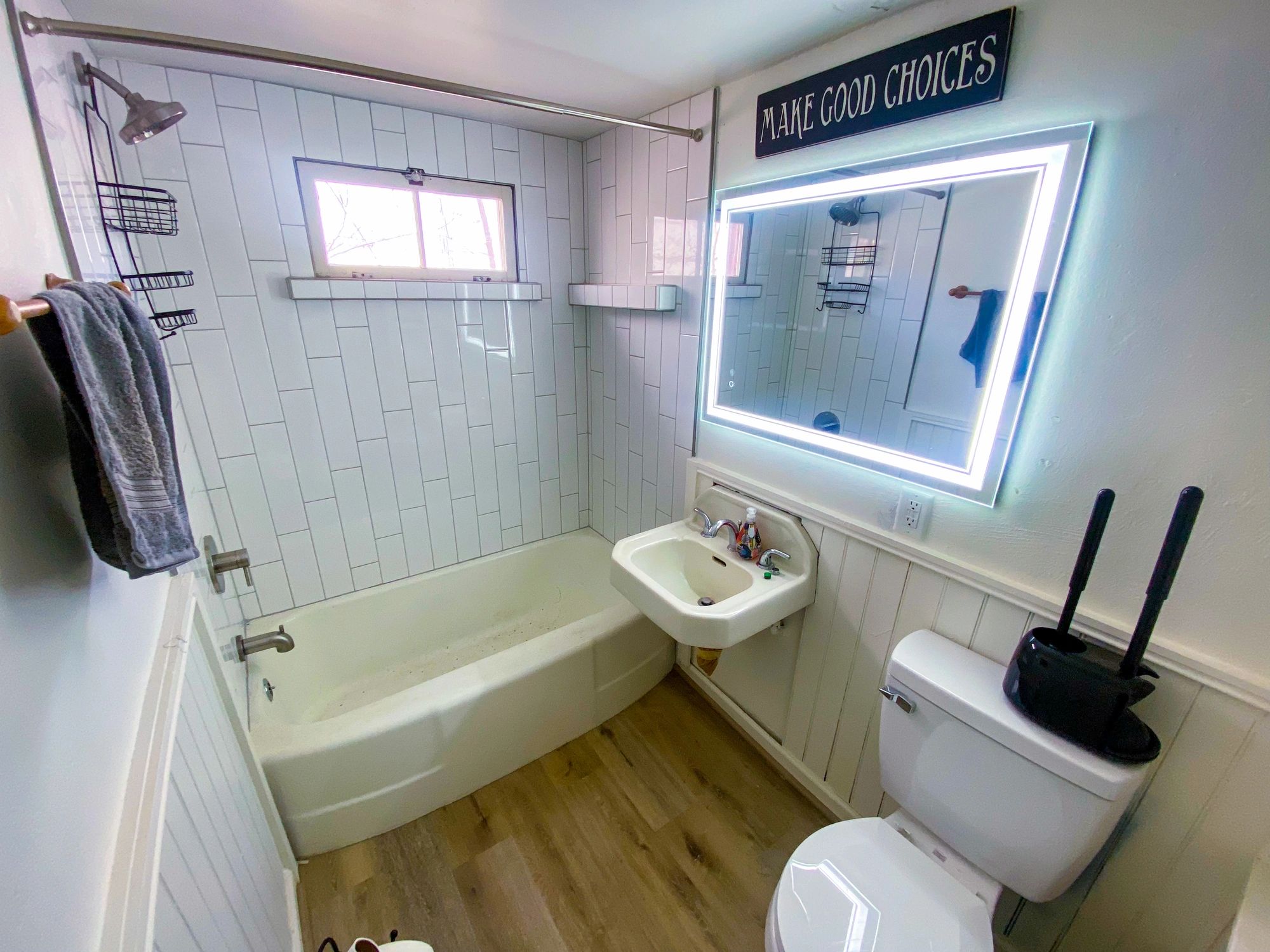 Remodeled bathroom interior with clean tile and updated fixtures