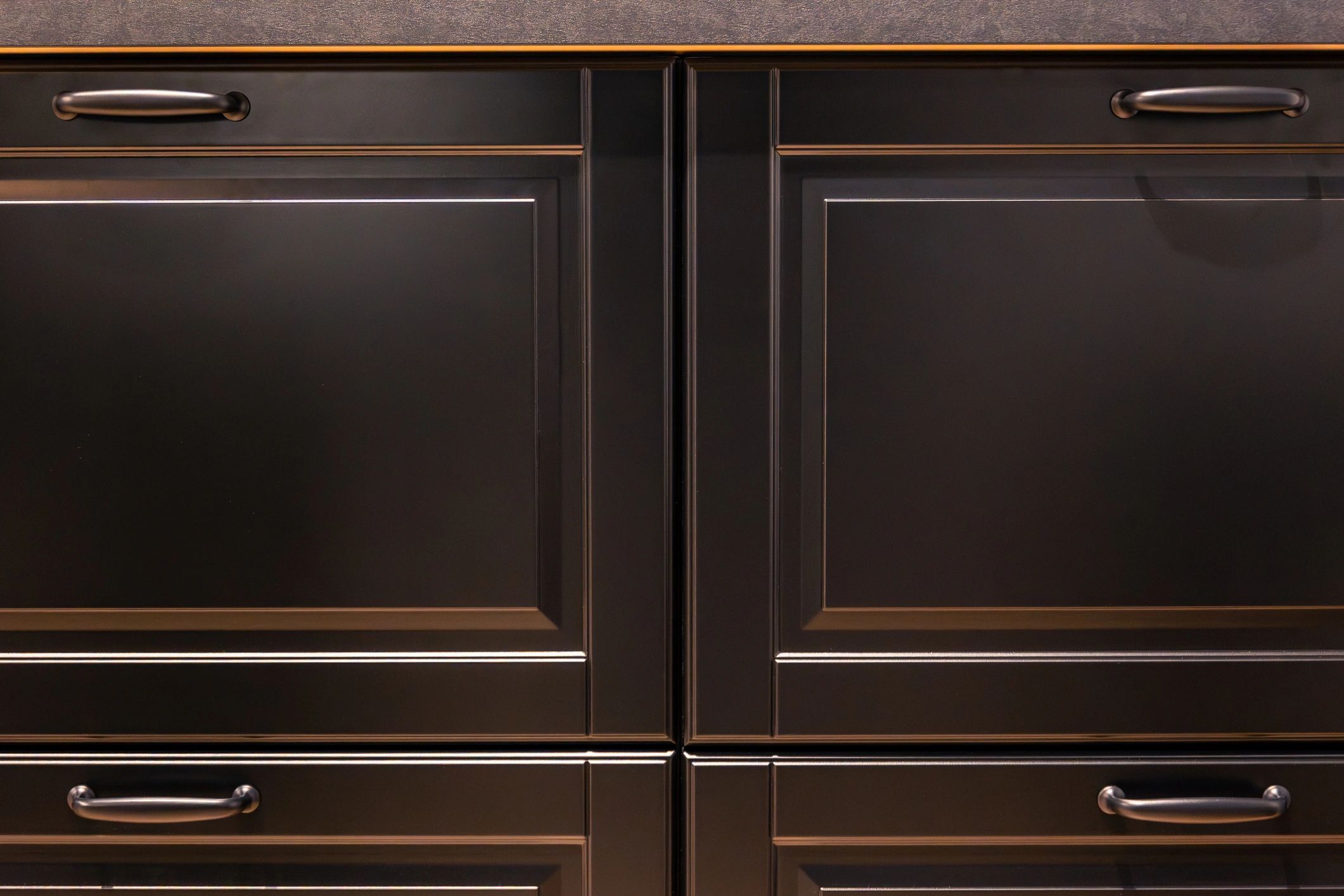 Custom dark kitchen cabinetry with premium finish